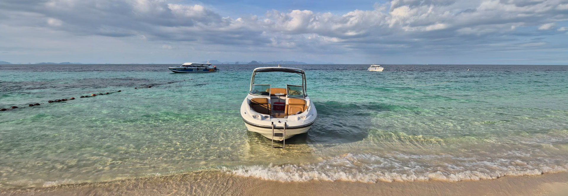 Merry Fisher 1095Fly cruising on turquoise water